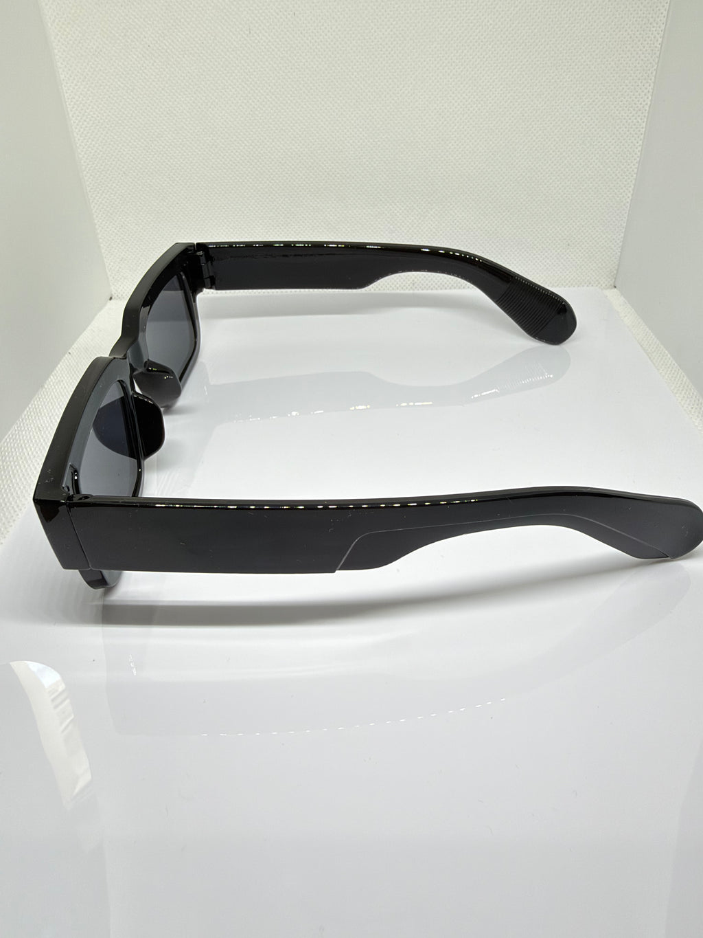 Glossy black Obsidian sunglasses with a chunky rectangular design