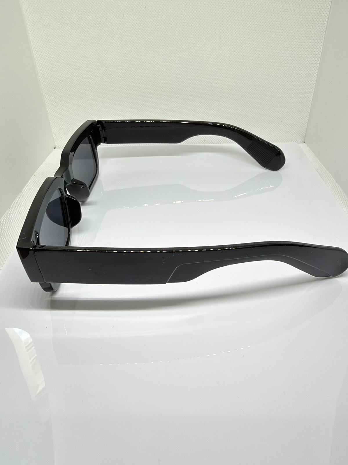 Glossy black Obsidian sunglasses with a chunky rectangular design