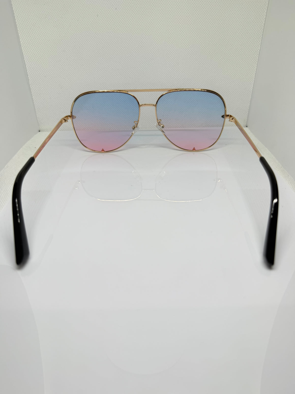Close-up of Ibiza sunglasses showing the gold-tone frame