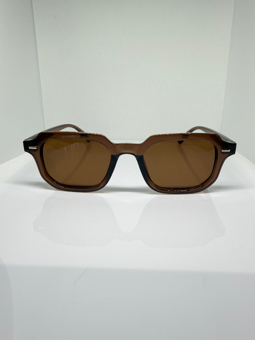 Mocha brown rectangular sunglasses with warm brown tinted lenses