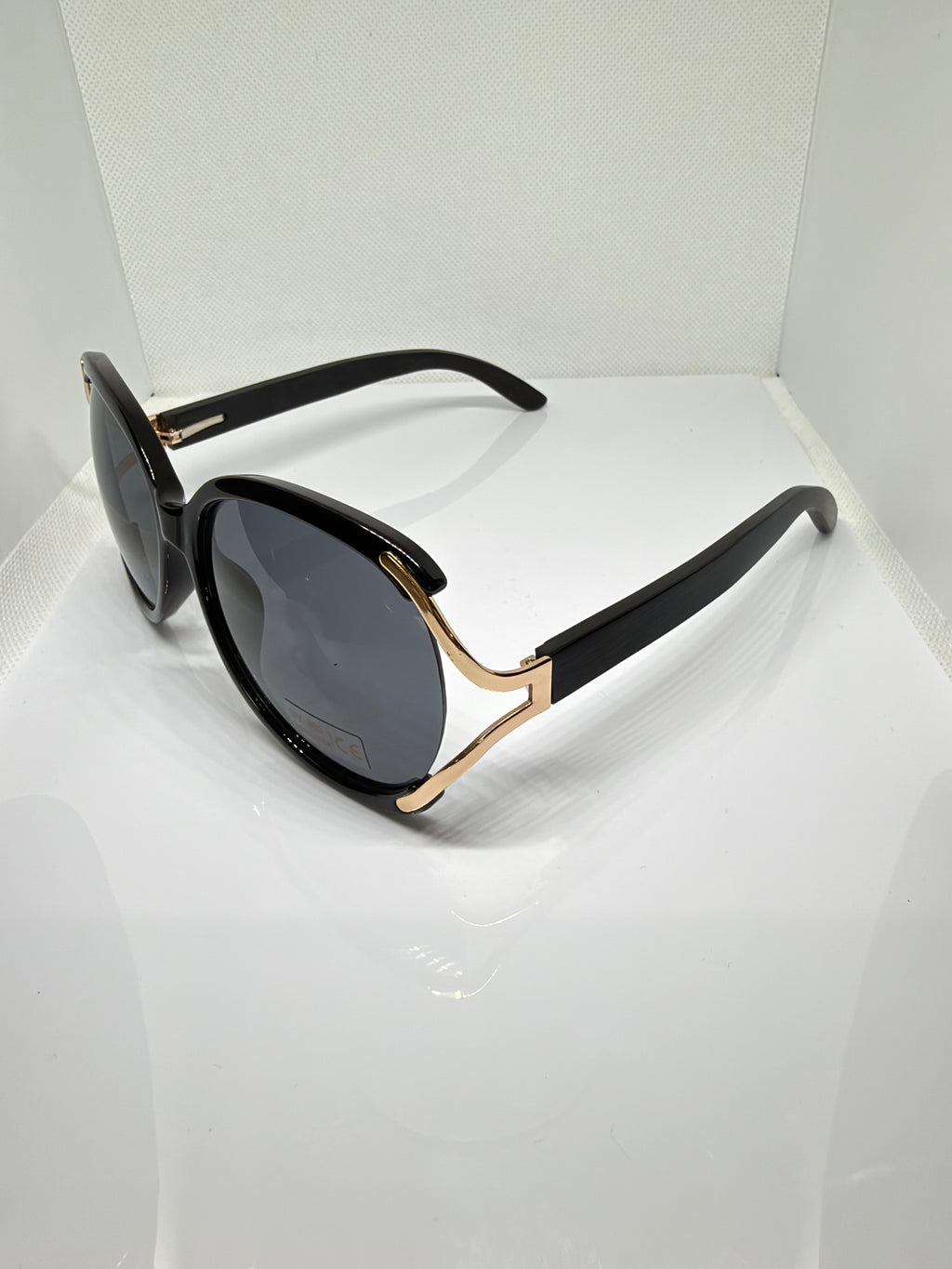 Side view of Sorrento black and gold round sunglasses
