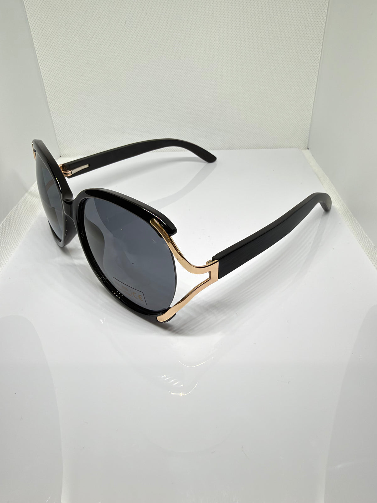 Side view of Sorrento black and gold round sunglasses