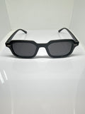 Oslo black rectangular sunglasses with dark tinted lenses