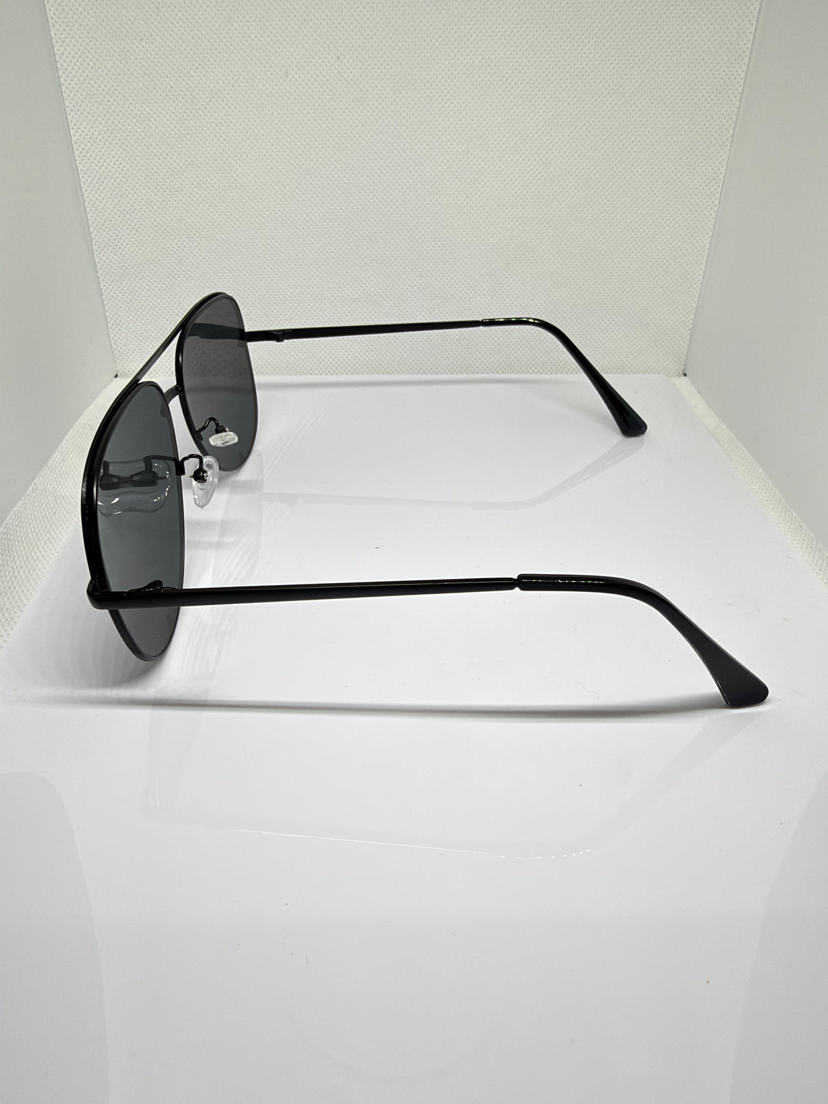 Side view of Shadow black aviator sunglasses with silver details
