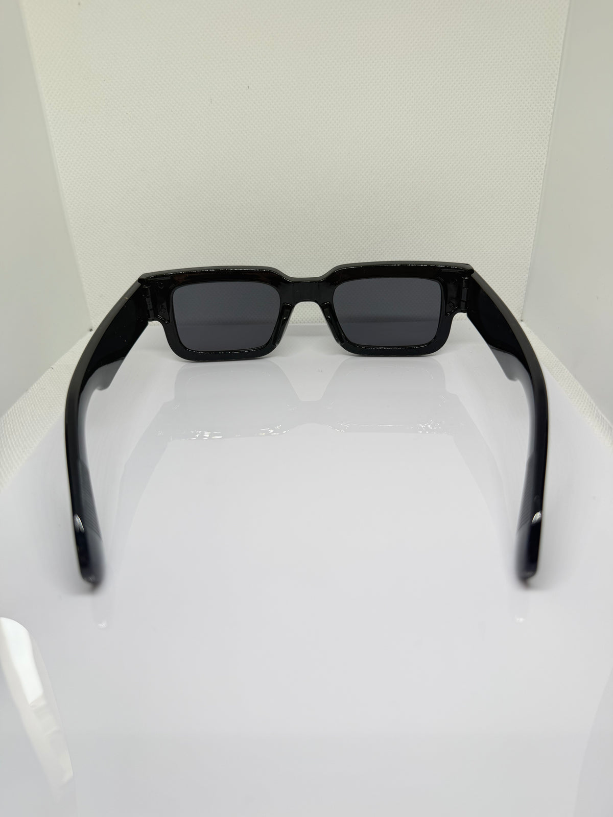 Obsidian black rectangle sunglasses with a bold statement silhouette
