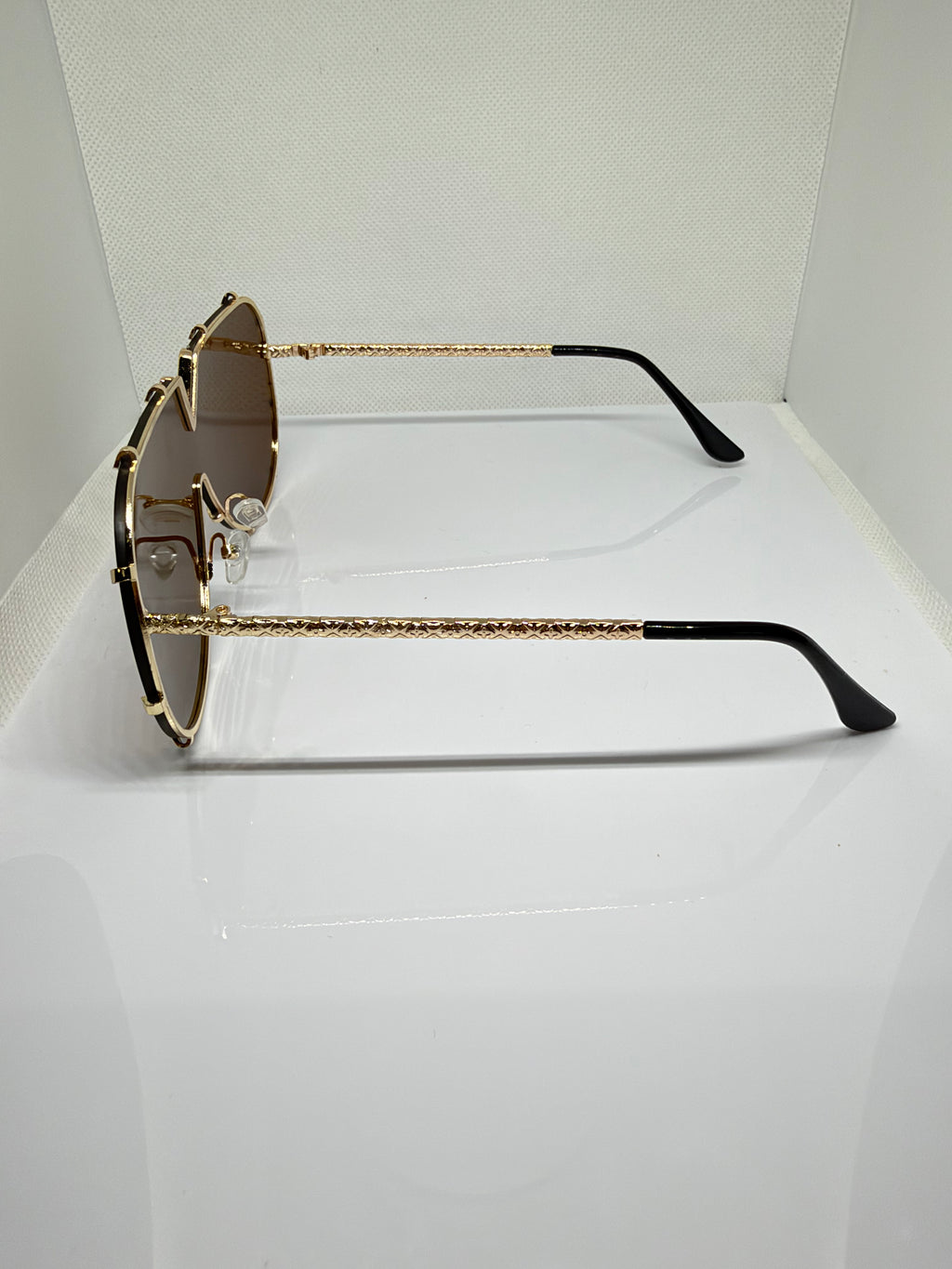 Close-up of Sienna sunglasses showing the V-detail frame