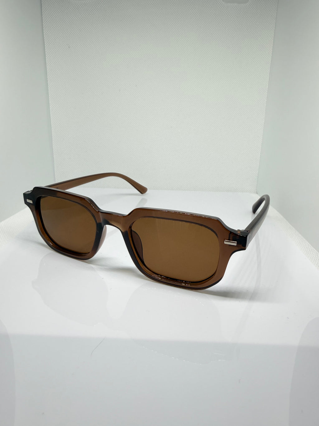 Mocha sunglasses with a classic brown frame and rectangular lenses