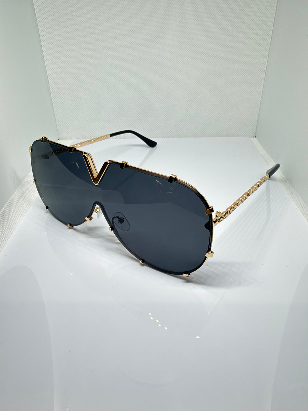 Side view of Valencia black and gold aviator sunglasses