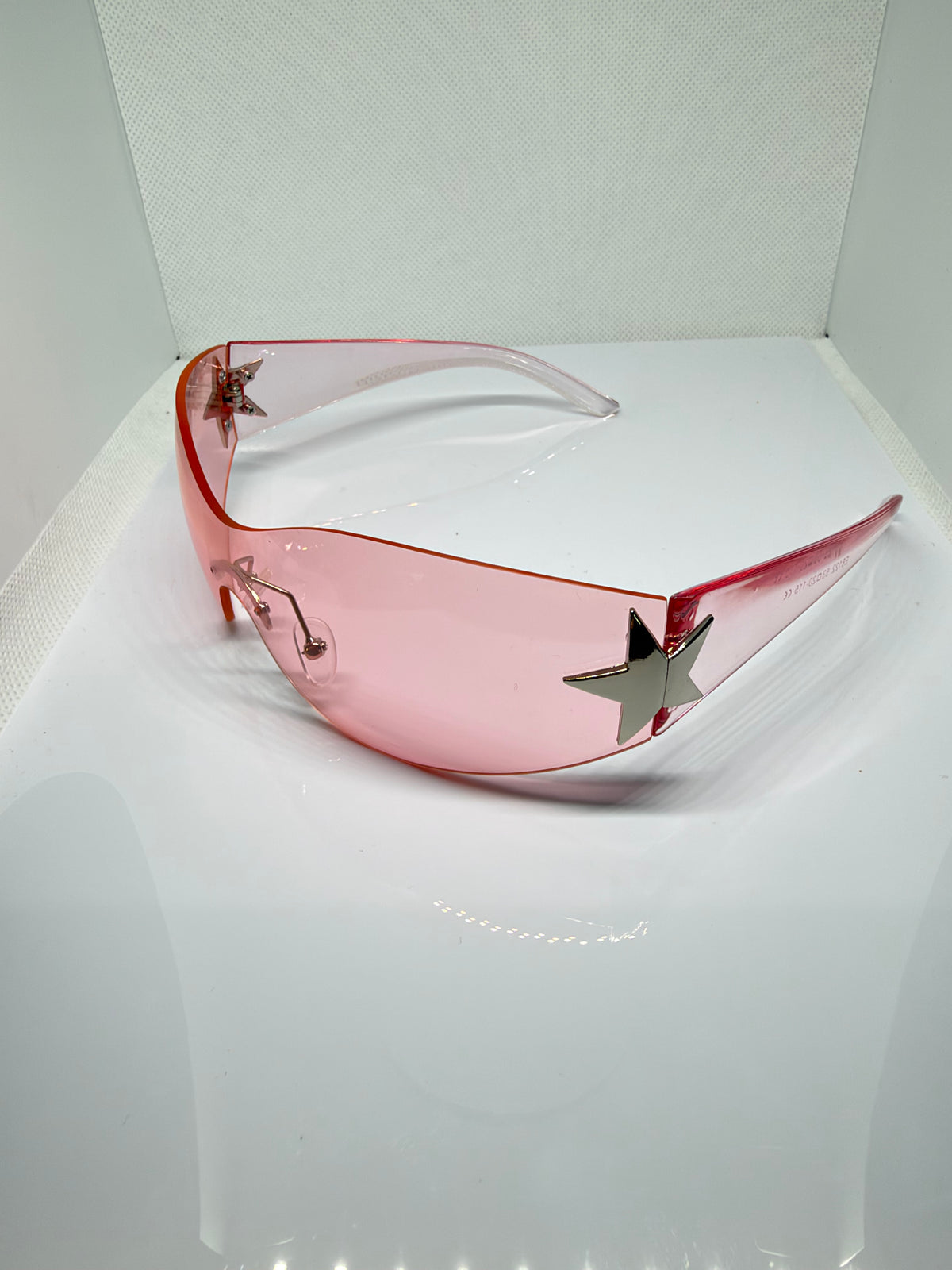 Side view of Stella blush pink shield sunglasses