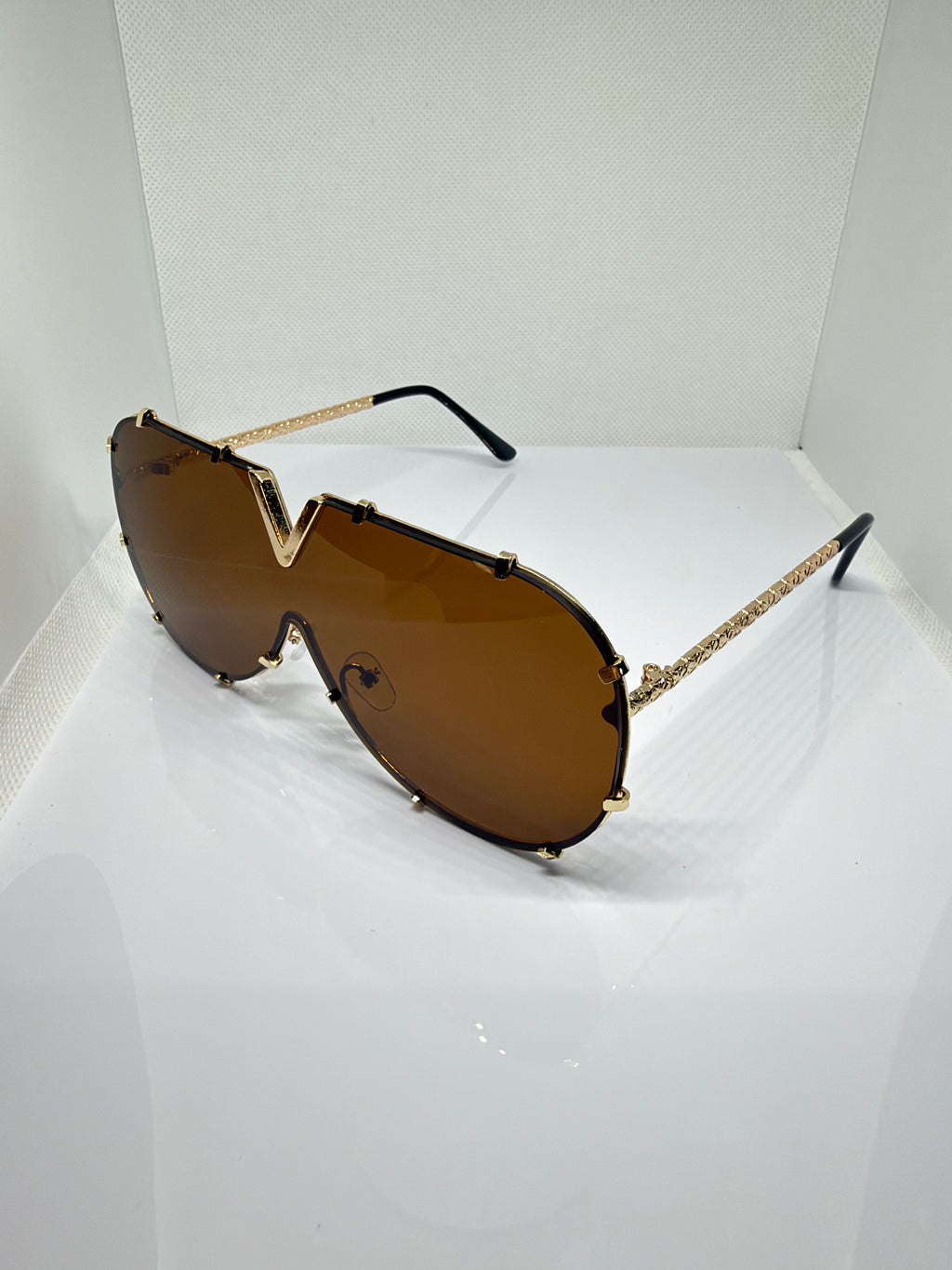 Side view of Sienna brown V-detail oversized sunglasses
