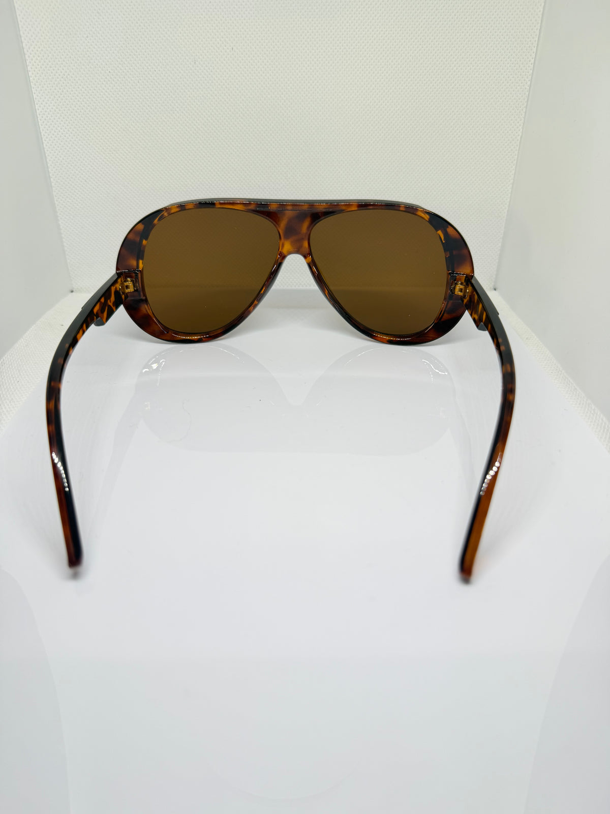 Havana brown tortoiseshell sunglasses with warm tinted lenses
