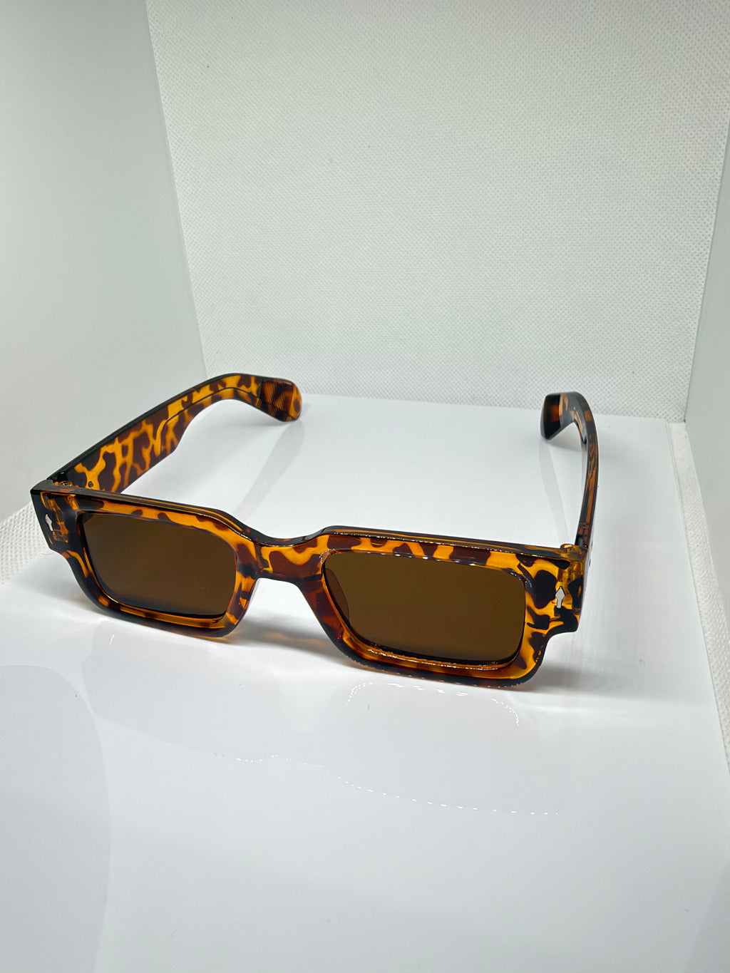 Close-up of Tortuga tortoiseshell sunglasses showing the brown lenses
